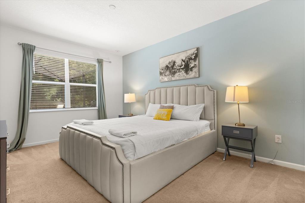 4565 Cabello Loop Kissimmee, FL 34746 - Photo 13 of 33 a bedroom with a bed and a window