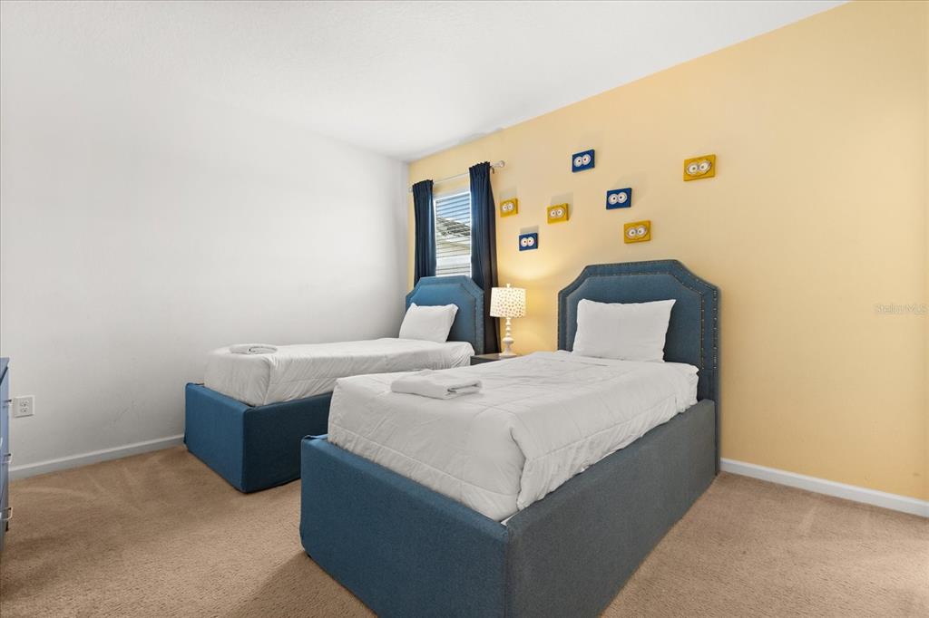 4565 Cabello Loop Kissimmee, FL 34746 - Photo 17 of 33 a bedroom with a bed and lamp