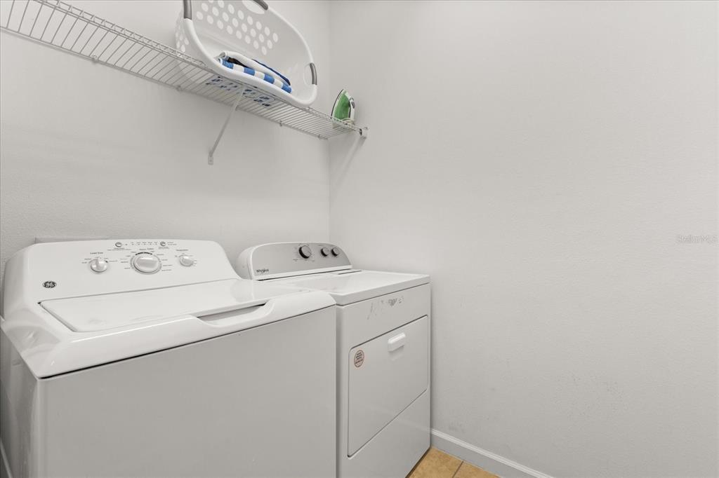 4565 Cabello Loop Kissimmee, FL 34746 - Photo 20 of 33 a utility room with dryer and washer