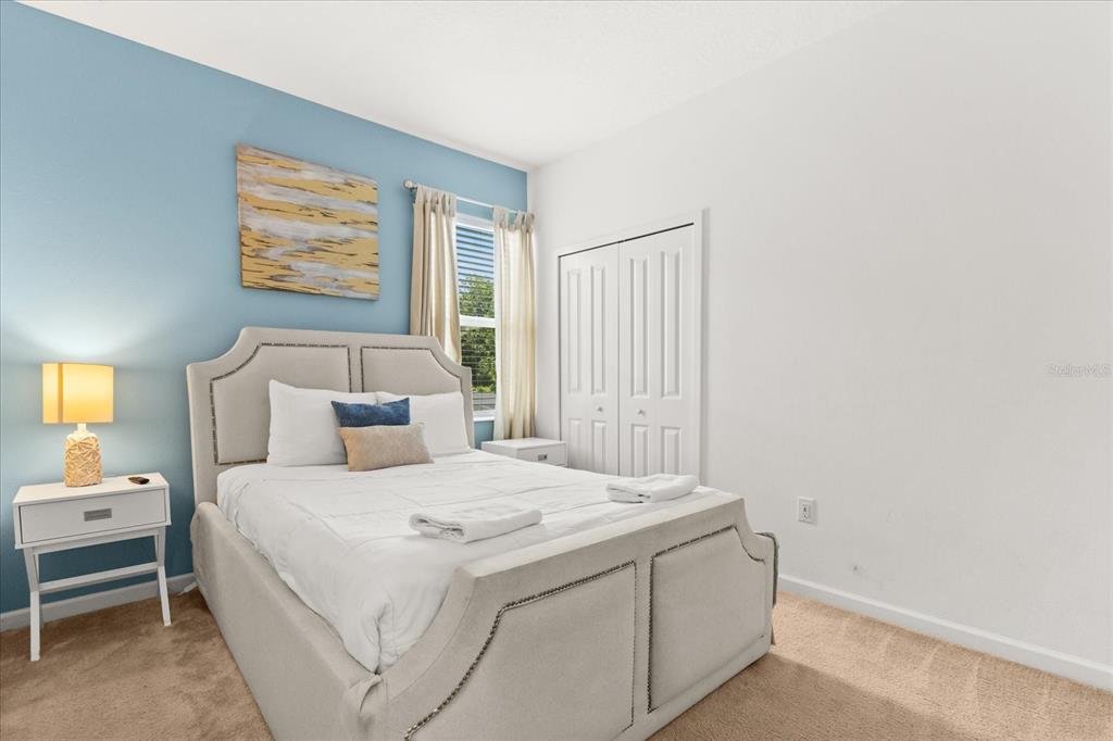 4565 Cabello Loop Kissimmee, FL 34746 - Photo 24 of 33 a bedroom with a bed and a window