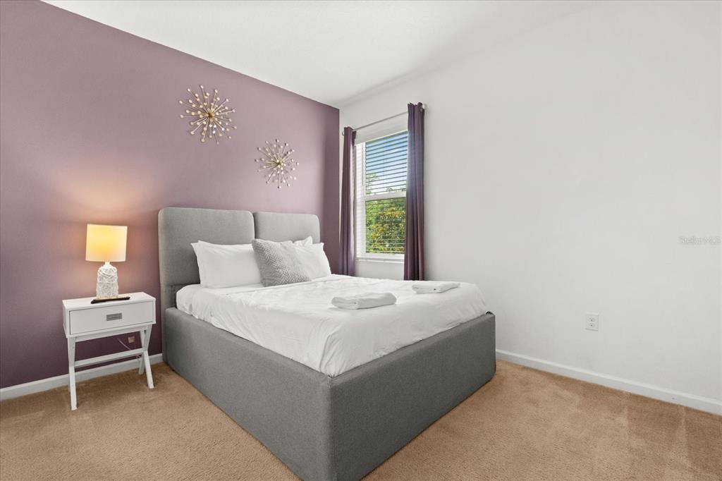 4565 Cabello Loop Kissimmee, FL 34746 - Photo 27 of 33 a bedroom with a bed and a window