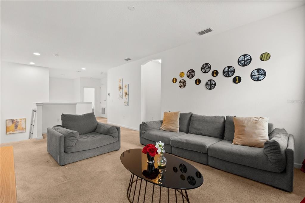 4565 Cabello Loop Kissimmee, FL 34746 - Photo 3 of 33 a living room with furniture and white walls