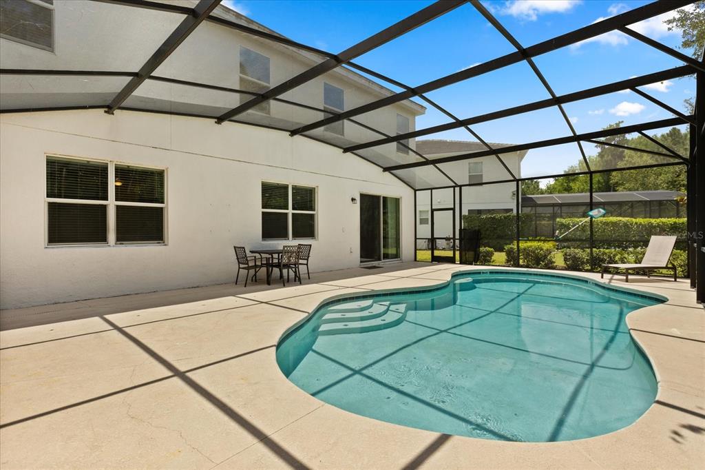 4565 Cabello Loop Kissimmee, FL 34746 - Photo 31 of 33 a view of a swimming pool with seating area