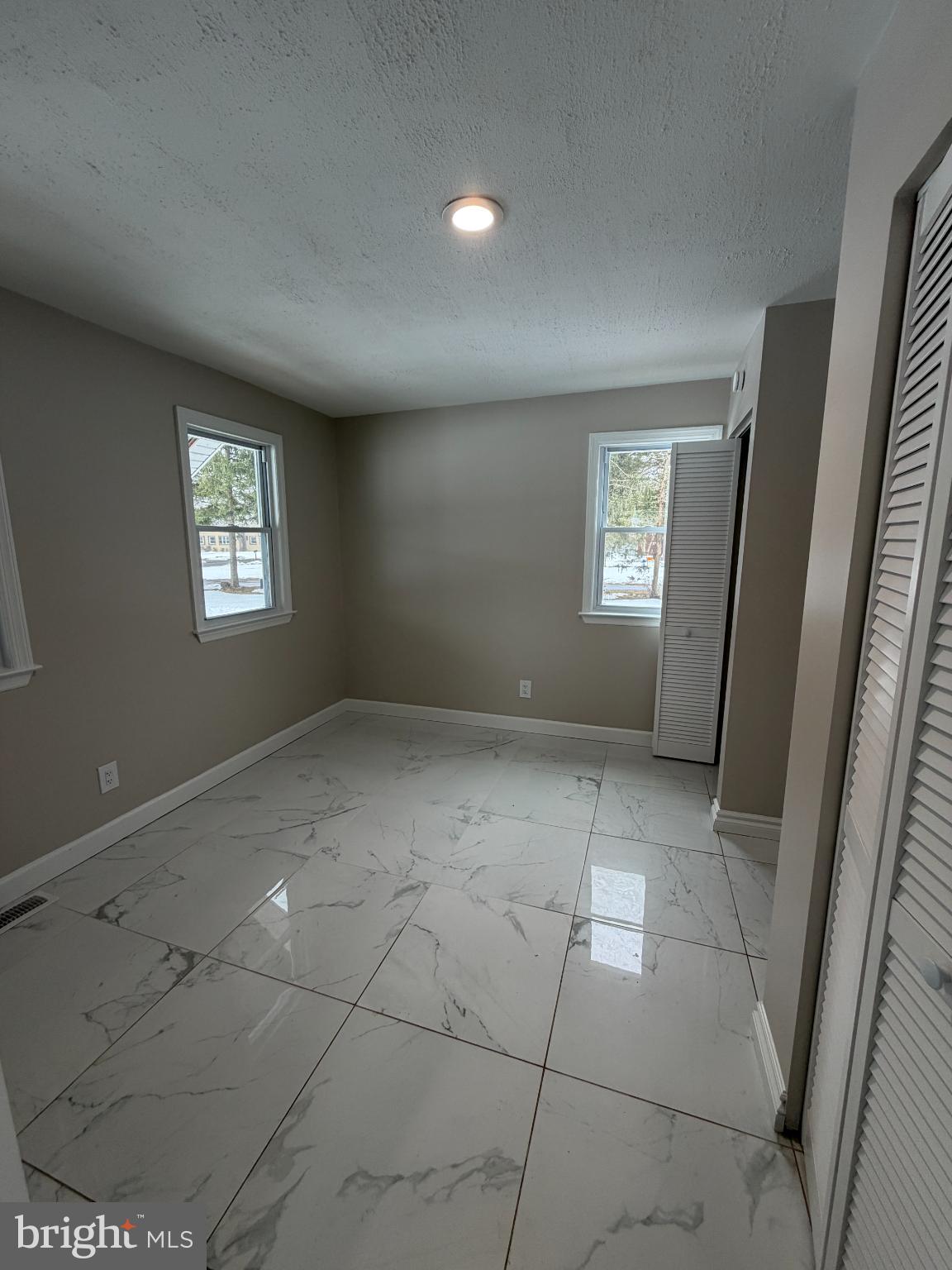 1059 Porchtown Road Franklinville, NJ 08322 - Photo 7 of 13 an empty room with windows