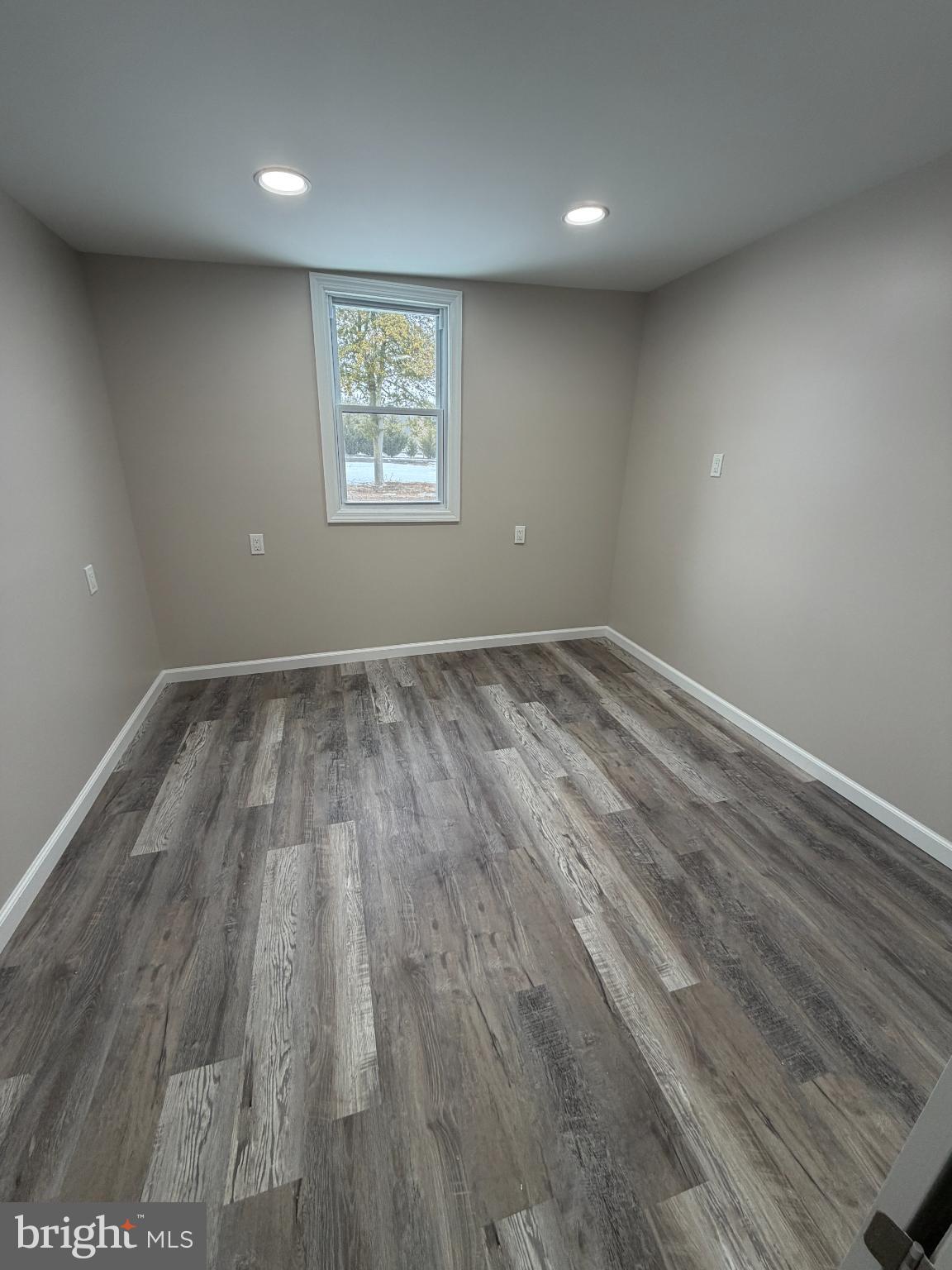 1059 Porchtown Road Franklinville, NJ 08322 - Photo 9 of 13 an empty room with wooden floor and windows