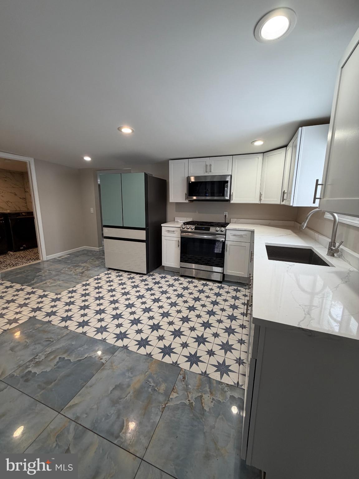 1059 Porchtown Road Franklinville, NJ 08322 - Photo 10 of 13 a kitchen with stainless steel appliances a sink and a stove