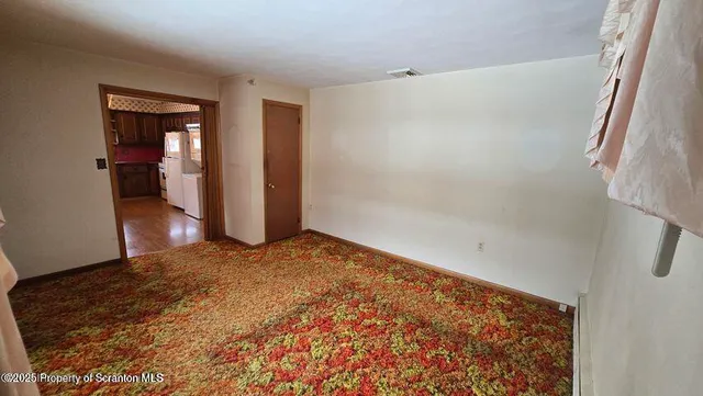 a bathroom with a sink and mirror with toilet