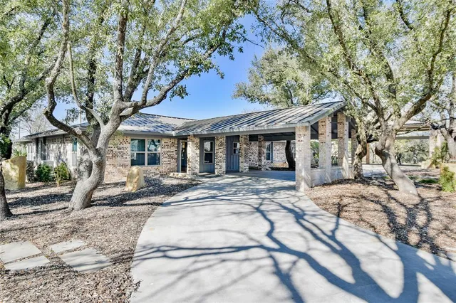 a view of swimming pool with outdoor seating and yard