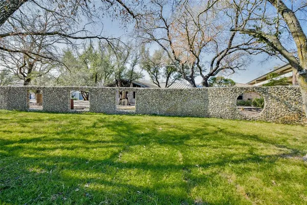 a view of swimming pool with outdoor seating and yard