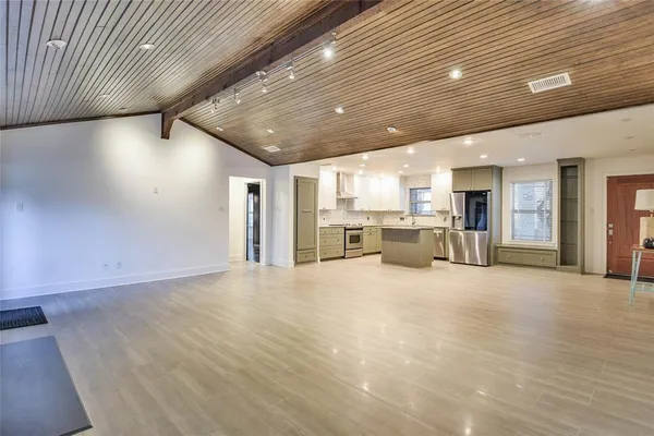 a view of a kitchen with a sink and a window