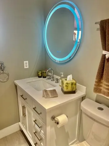 a living room with furniture and painting on the wall