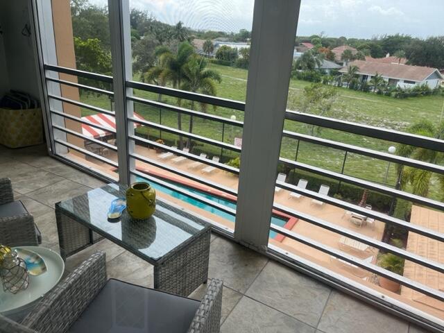 6461 Northwest 2nd Avenue, Unit FIVE Boca Raton, FL 33487 - Photo 38 of 61 Patio overlooking pool