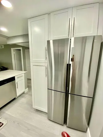 a bathroom with a toilet a sink and a mirror