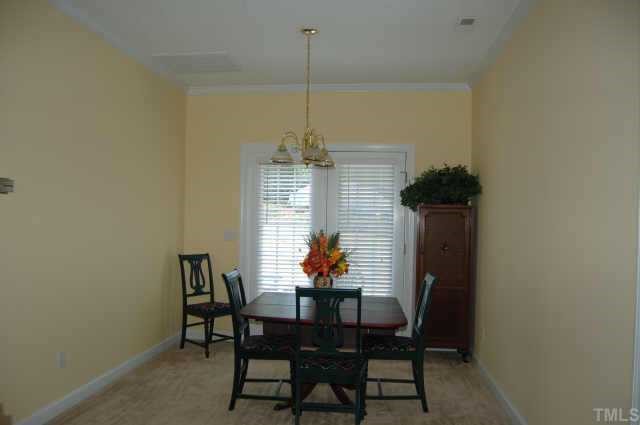 800 Rothshire Court Raleigh, NC 27615 - Photo 5 of 7 a dining room with furniture and window