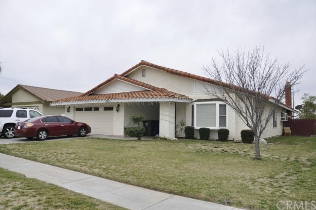 2945 East Mirada Road Highland, CA 92346 - Photo 1 of 1 a front view of a house with a garden