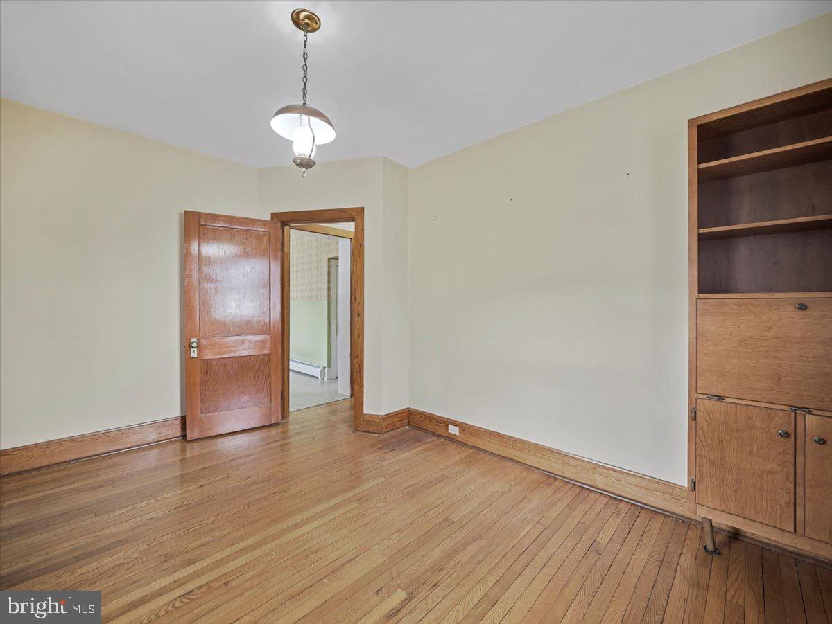 7220 Slabtown Road Waynesboro, PA 17268 - Photo 12 of 43 a view of an empty room with wooden floor and a window