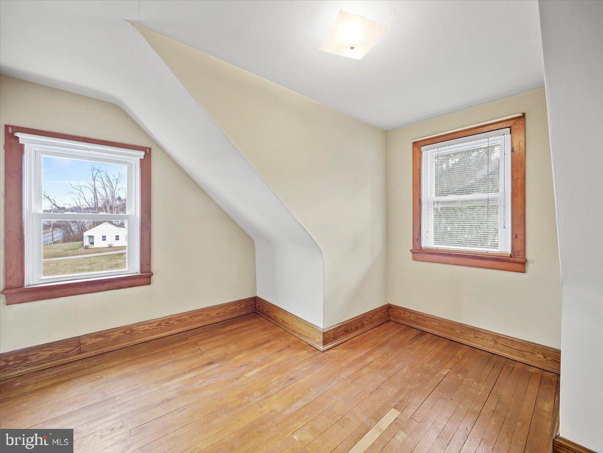 7220 Slabtown Road Waynesboro, PA 17268 - Photo 24 of 43 a view of an empty room with wooden floor and a window