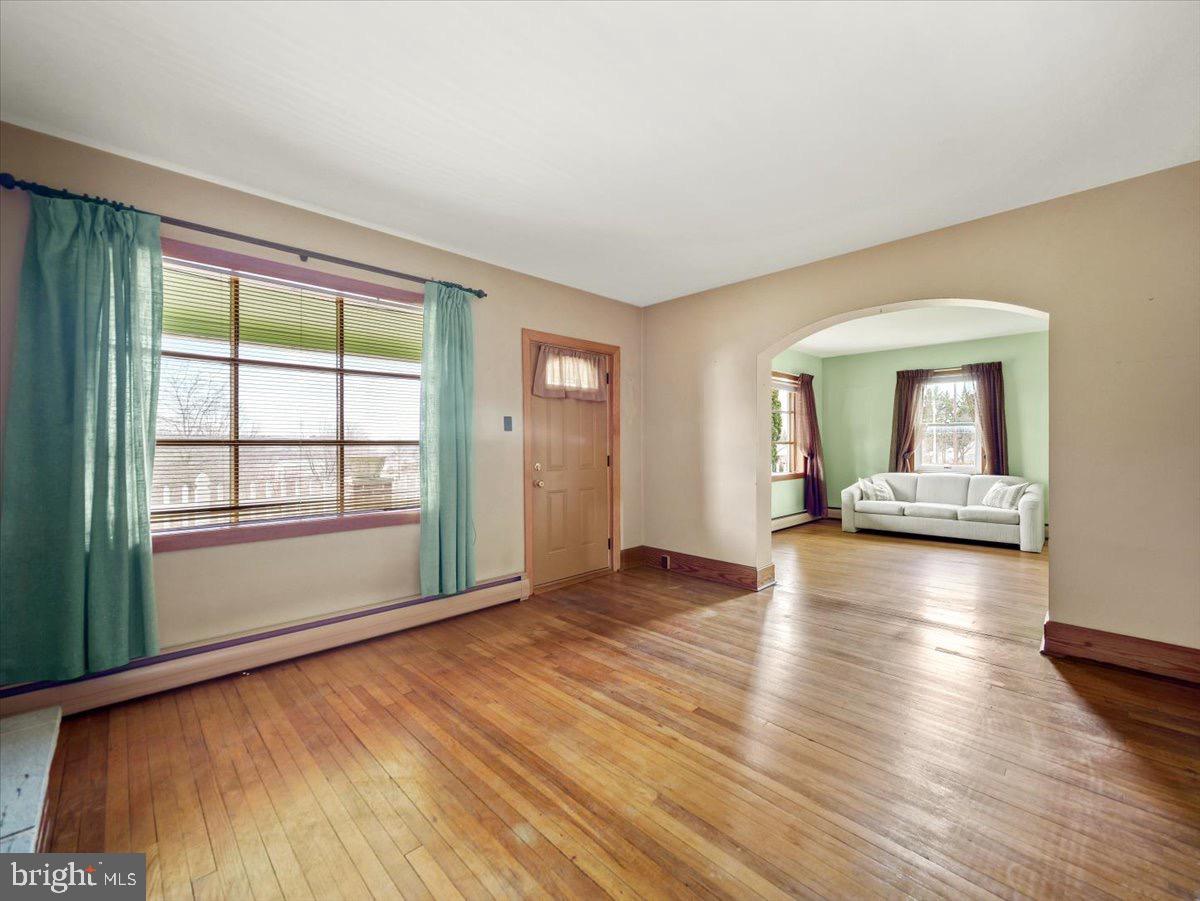 7220 Slabtown Road Waynesboro, PA 17268 - Photo 4 of 43 a view of a livingroom with wooden floor and a cabinet