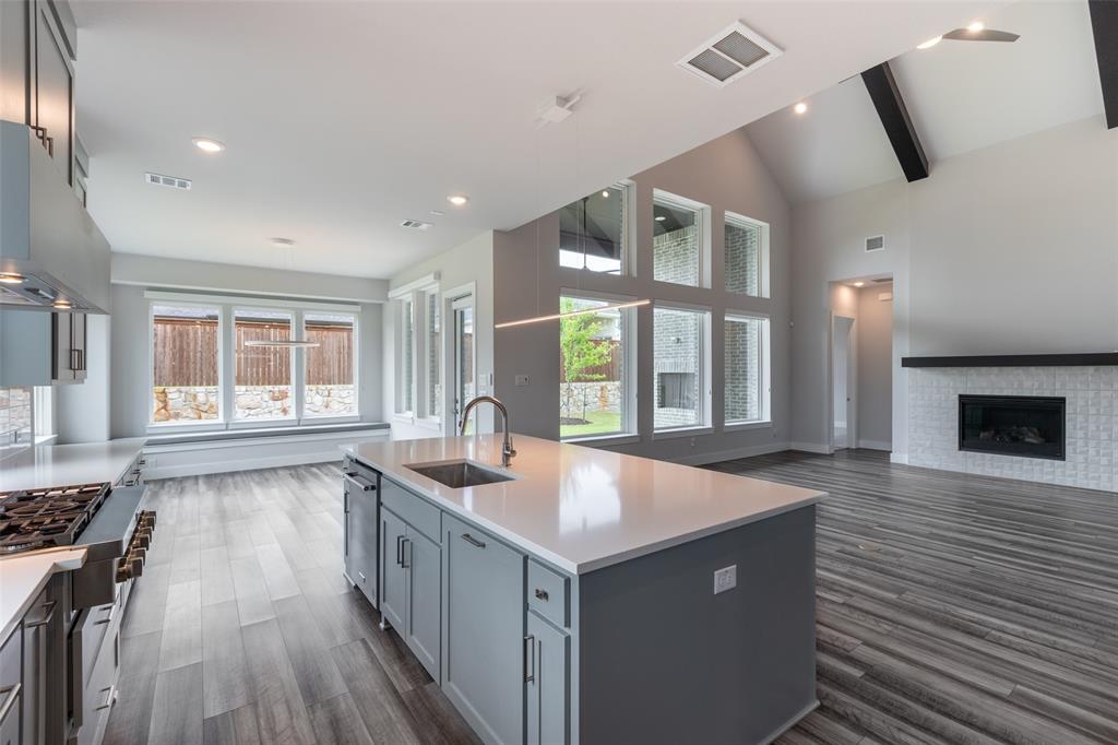 8003 Splitbeard Road Frisco, TX 75035 - Photo 14 of 40 a kitchen with sink stove and cabinets