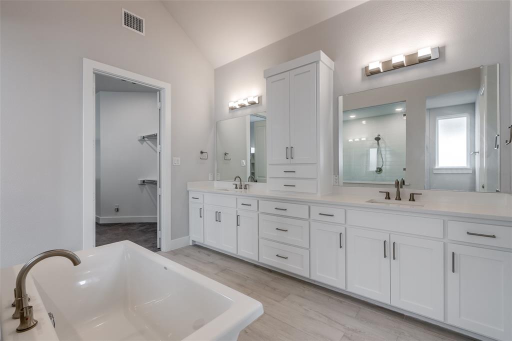 8003 Splitbeard Road Frisco, TX 75035 - Photo 26 of 40 a spacious en suite bathroom with double sink and a mirror