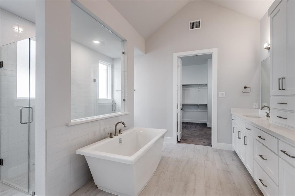 8003 Splitbeard Road Frisco, TX 75035 - Photo 27 of 40 a bathroom with a sink and a bathtub