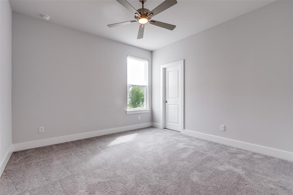8003 Splitbeard Road Frisco, TX 75035 - Photo 34 of 40 an empty room with windows and fan
