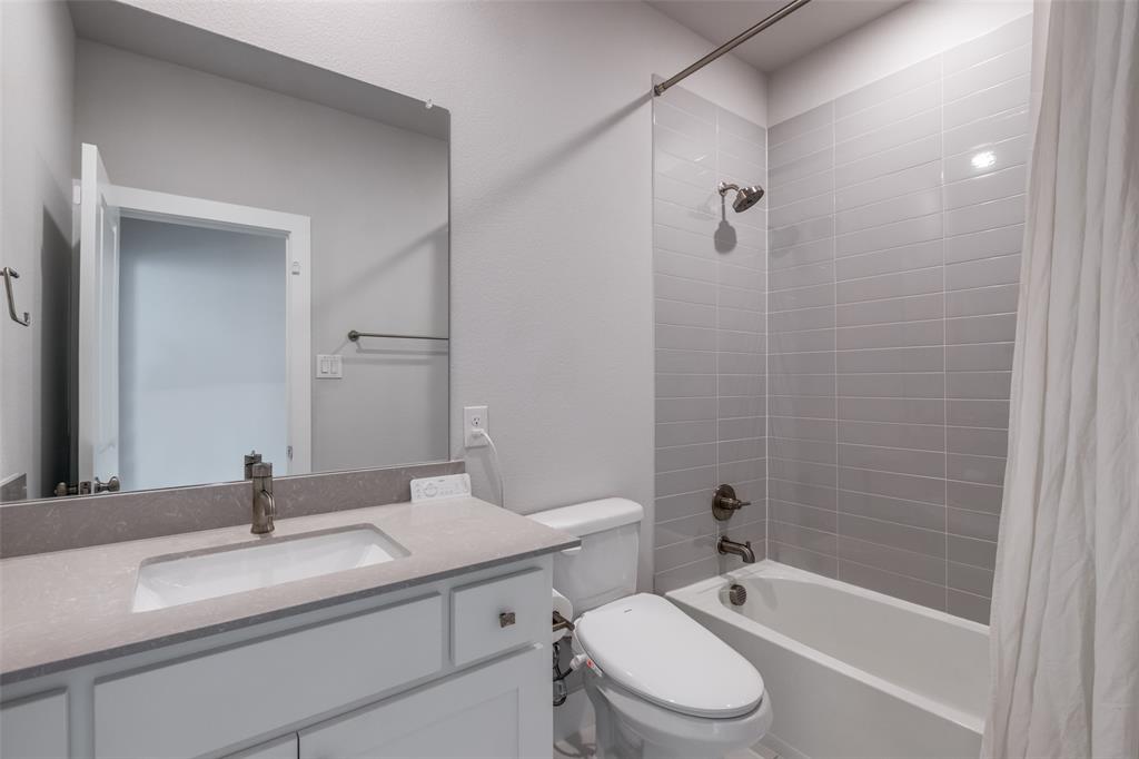 8003 Splitbeard Road Frisco, TX 75035 - Photo 35 of 40 a bathroom with a sink a toilet and shower