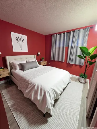 a bedroom with a bed and a painting on the wall