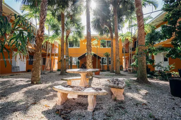 a view of a fountain in the yard of a house