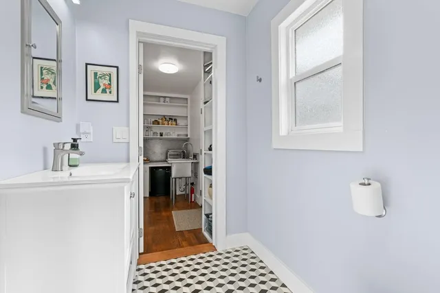 a kitchen with a refrigerator and a stove