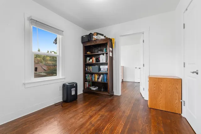a room with window and wooden floor