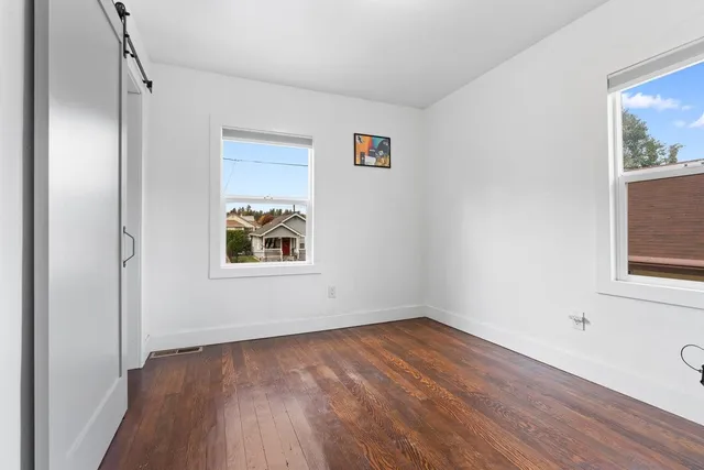 a bathroom with a sink vanity and toilet