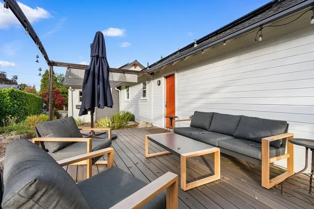 a view of a chair and table in patio