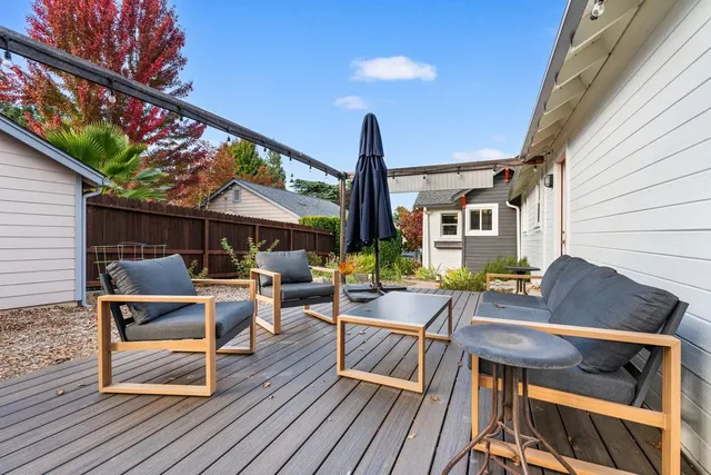 a view of a dinning table and chairs in the patio