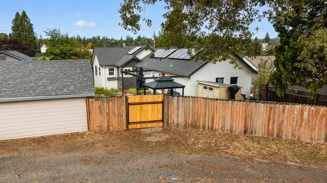 a view of a back yard of the house