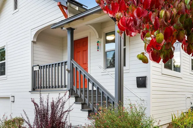 a view of a house with a small yard