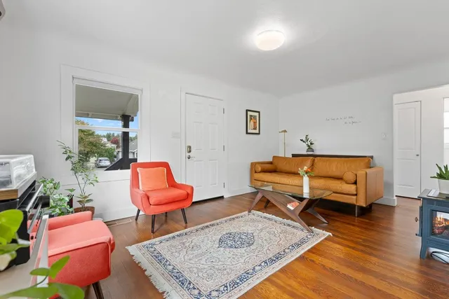 a living room with furniture and a table