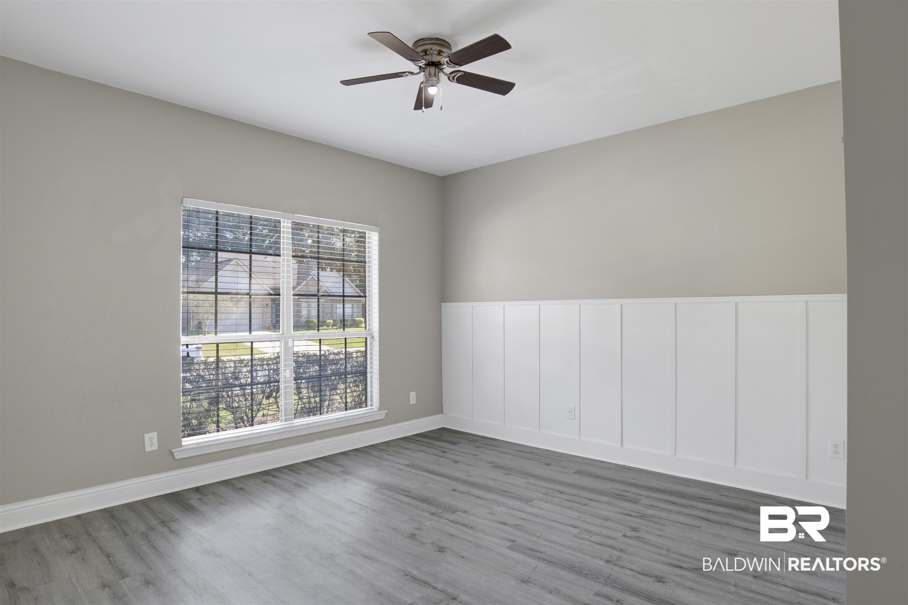 24159 Tullamore Drive Daphne, AL 36526 - Photo 17 of 31 Unfurnished room featuring ceiling fan, plenty of natural light, and hardwood / wood-style floors