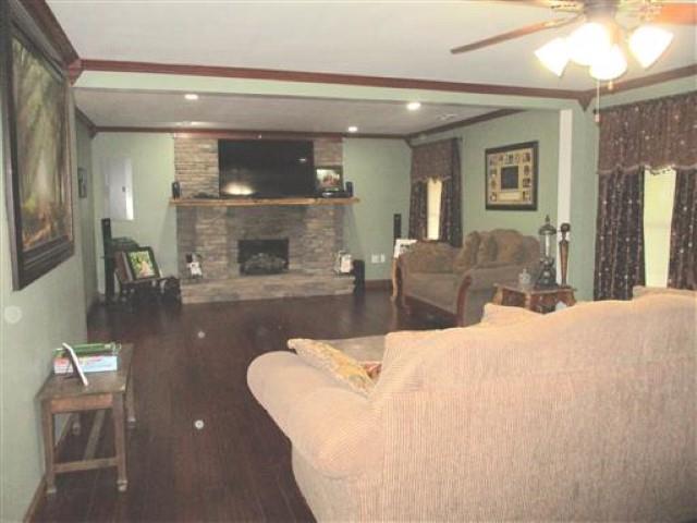 1406 Joe Williams Road Loretto, TN 38469 - Photo 1 of 20 a living room with furniture and a fireplace