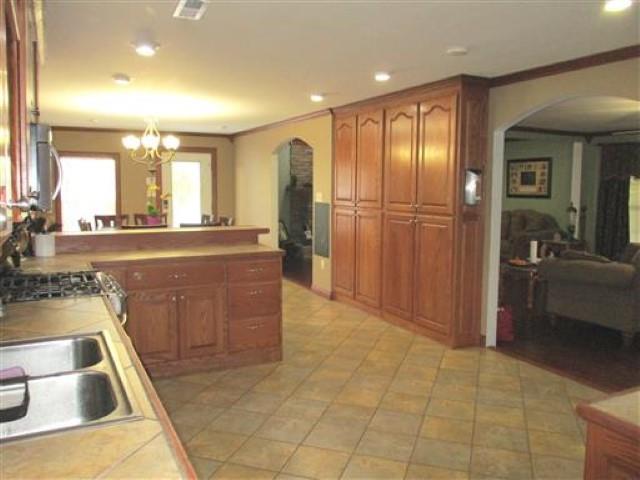 1406 Joe Williams Road Loretto, TN 38469 - Photo 6 of 20 a view of a kitchen with a sink and a refrigerator