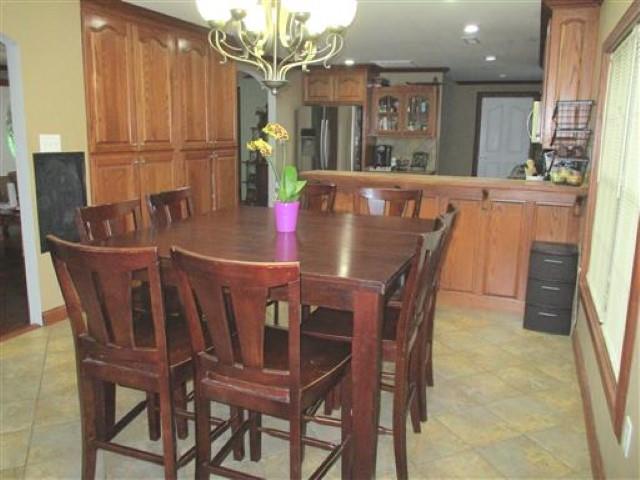 1406 Joe Williams Road Loretto, TN 38469 - Photo 7 of 20 a view of a dining room with furniture and wooden floor