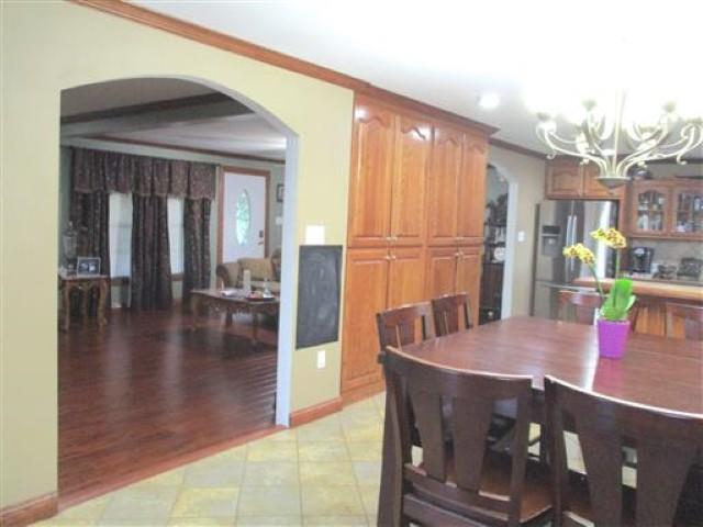 1406 Joe Williams Road Loretto, TN 38469 - Photo 8 of 20 a view of a dining room with furniture one side kitchen view