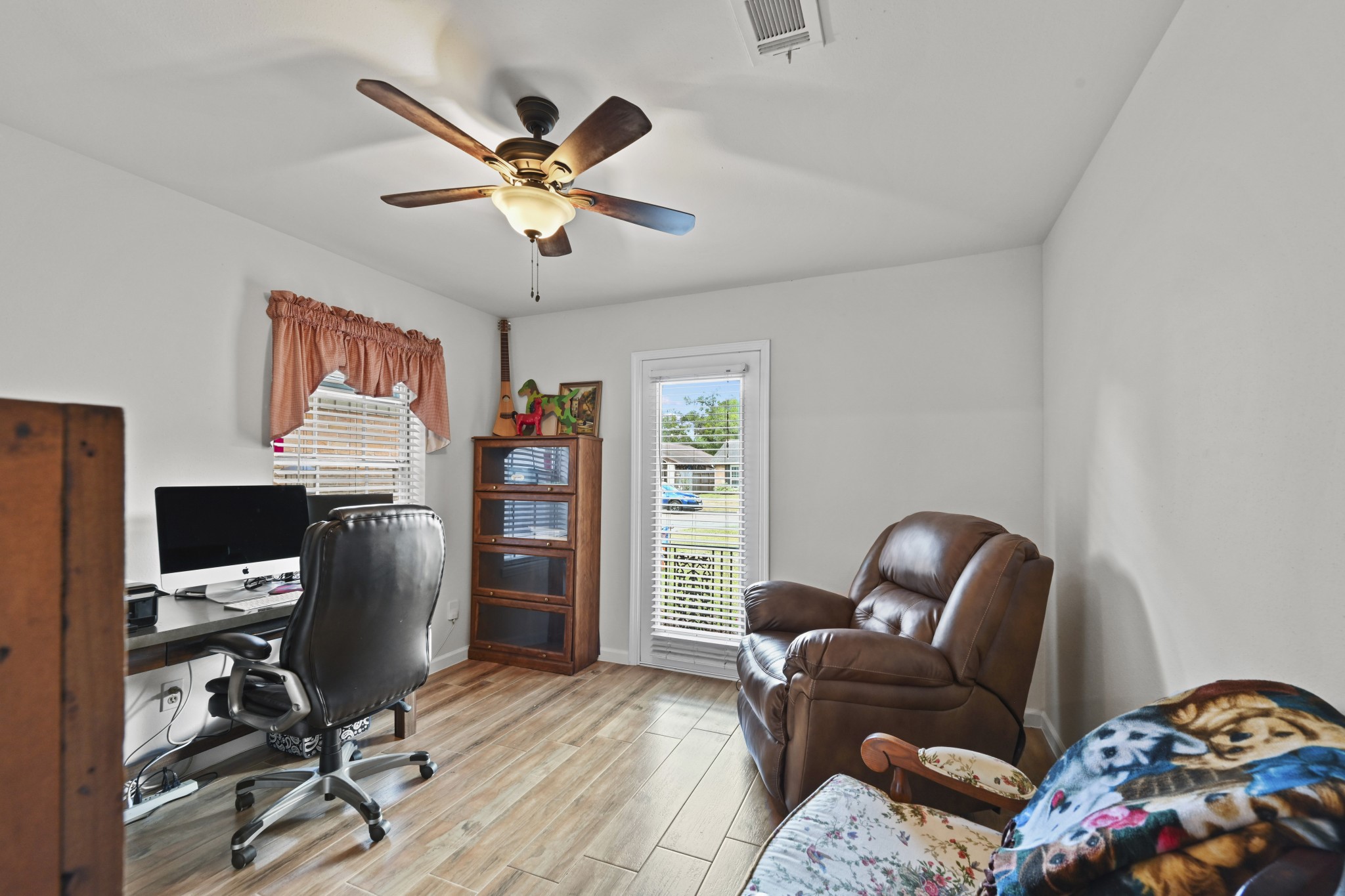 13823 Wickersham Lane Houston, TX 77077 - Photo 13 of 24 a work room with furniture and a window