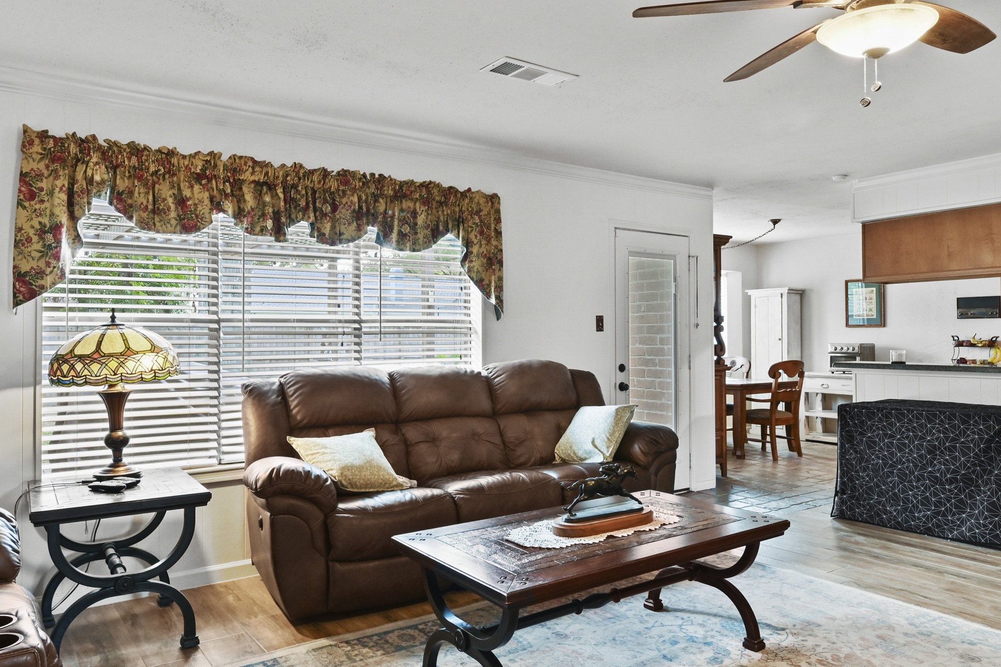 13823 Wickersham Lane Houston, TX 77077 - Photo 14 of 24 a living room with furniture and a table