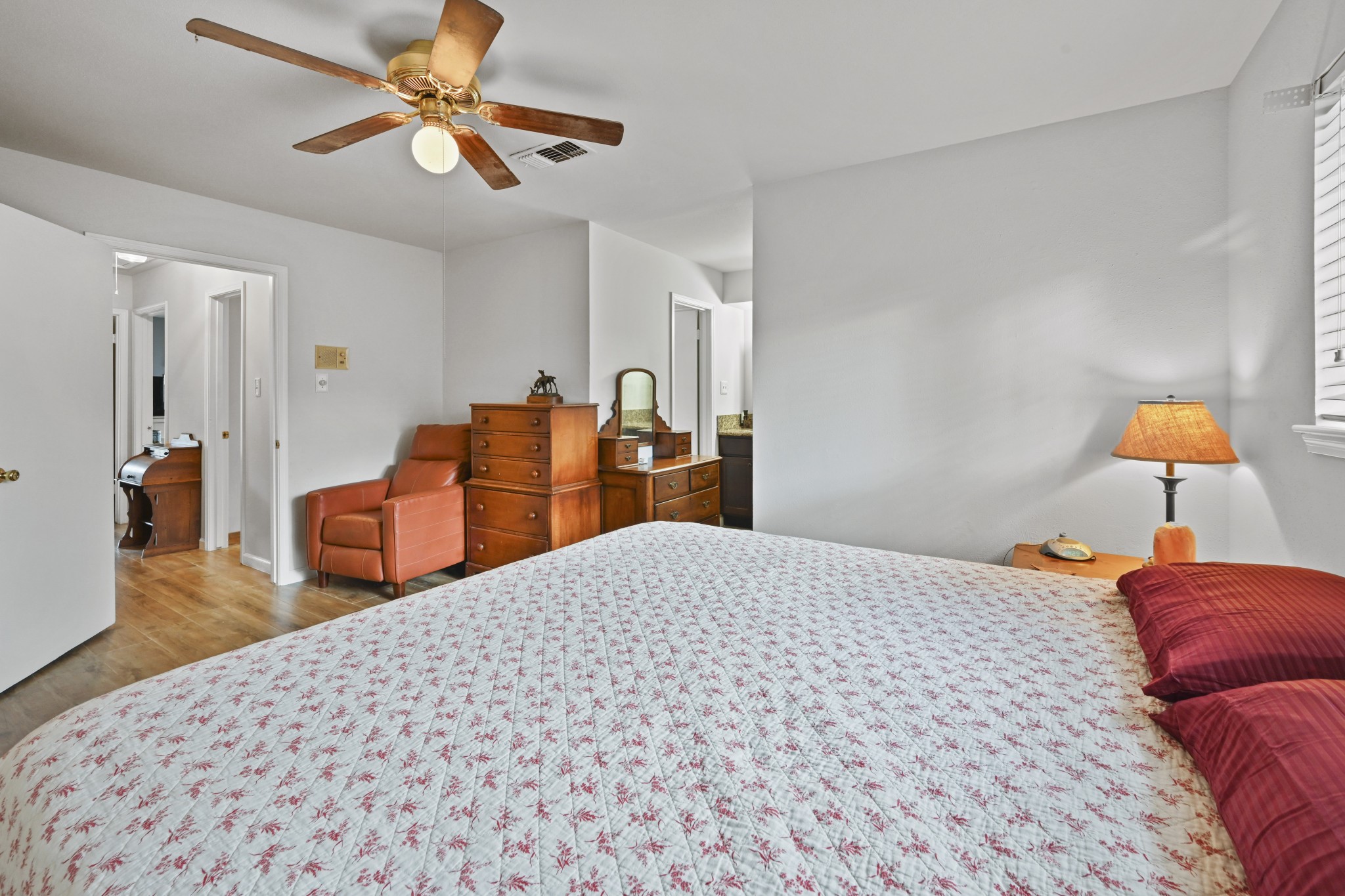 13823 Wickersham Lane Houston, TX 77077 - Photo 17 of 24 a bedroom with a bed and dresser