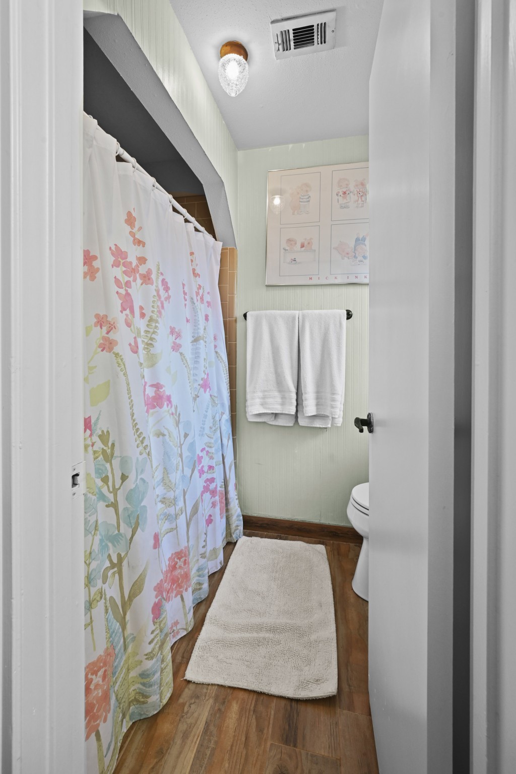 13823 Wickersham Lane Houston, TX 77077 - Photo 19 of 24 a bathroom with a bathtub and shower curtain