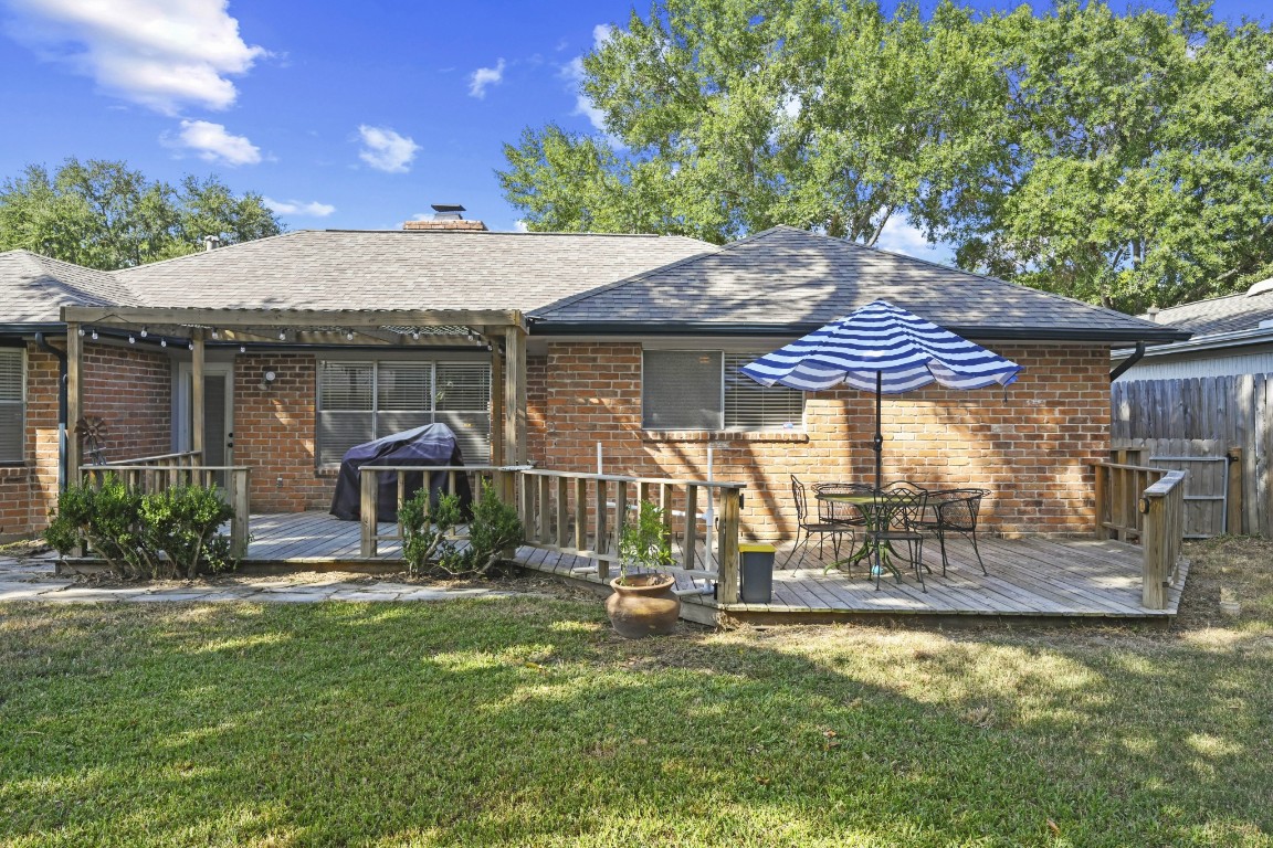 13823 Wickersham Lane Houston, TX 77077 - Photo 20 of 24 a view of a house with backyard and sitting area