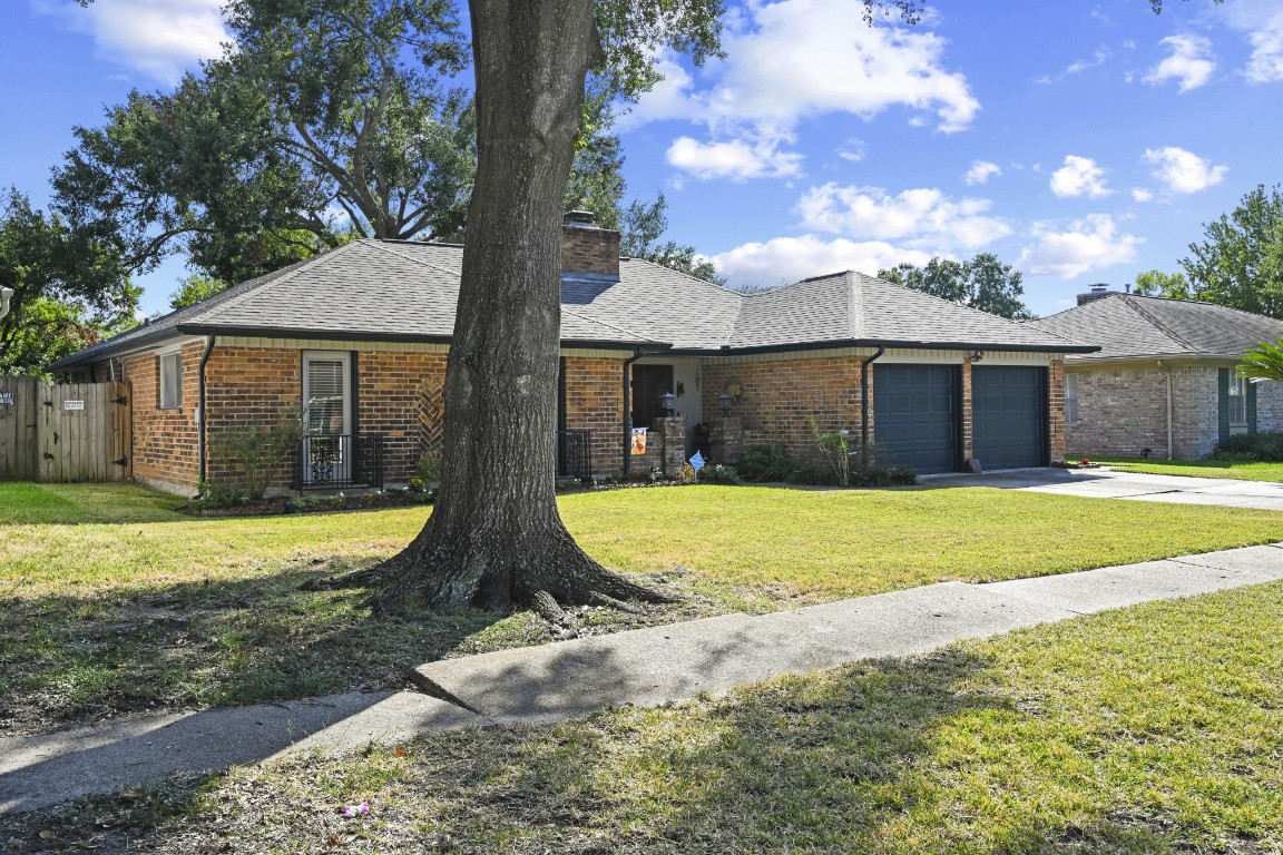 13823 Wickersham Lane Houston, TX 77077 - Photo 2 of 24 a view of a house with swimming pool and a yard