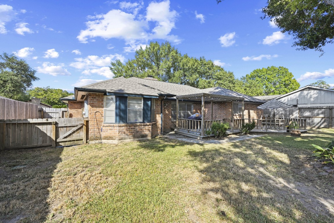 13823 Wickersham Lane Houston, TX 77077 - Photo 21 of 24 a view of a house with a yard patio and wooden floor