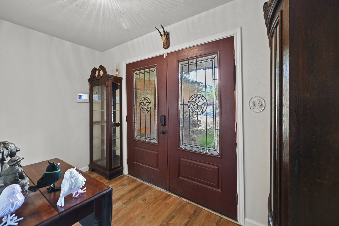 13823 Wickersham Lane Houston, TX 77077 - Photo 5 of 24 a bed room with a bed and a window
